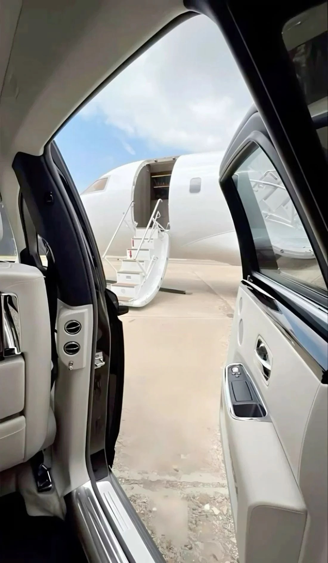 A car meets a family at the private jet steps for a Disney trip